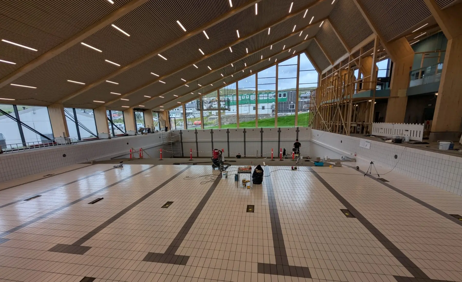 Large-format tiling inside the Bylgjan swimming hall, Runavík, completed 2025