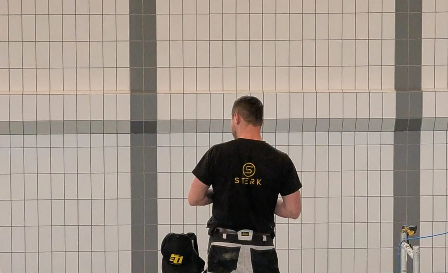 STERK tiling crew at work in the Bylgjan swimming hall, Runavík